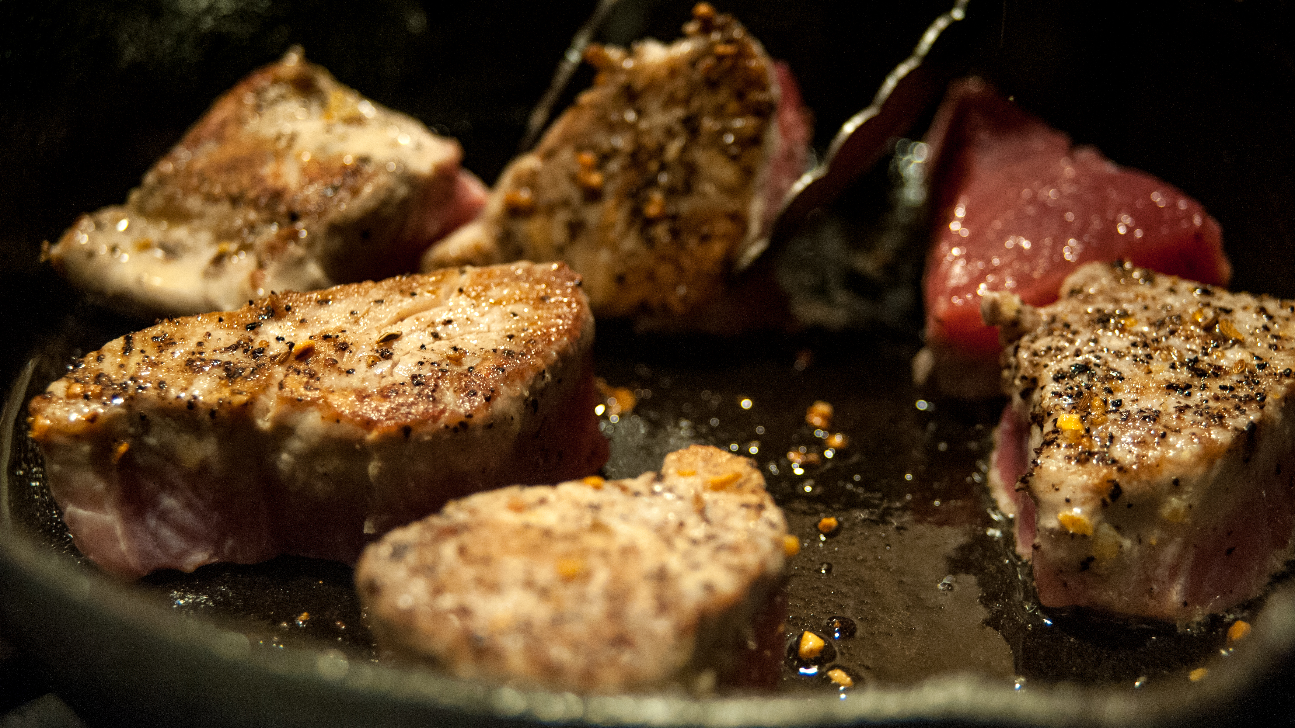 tuna being cooked on a skillet