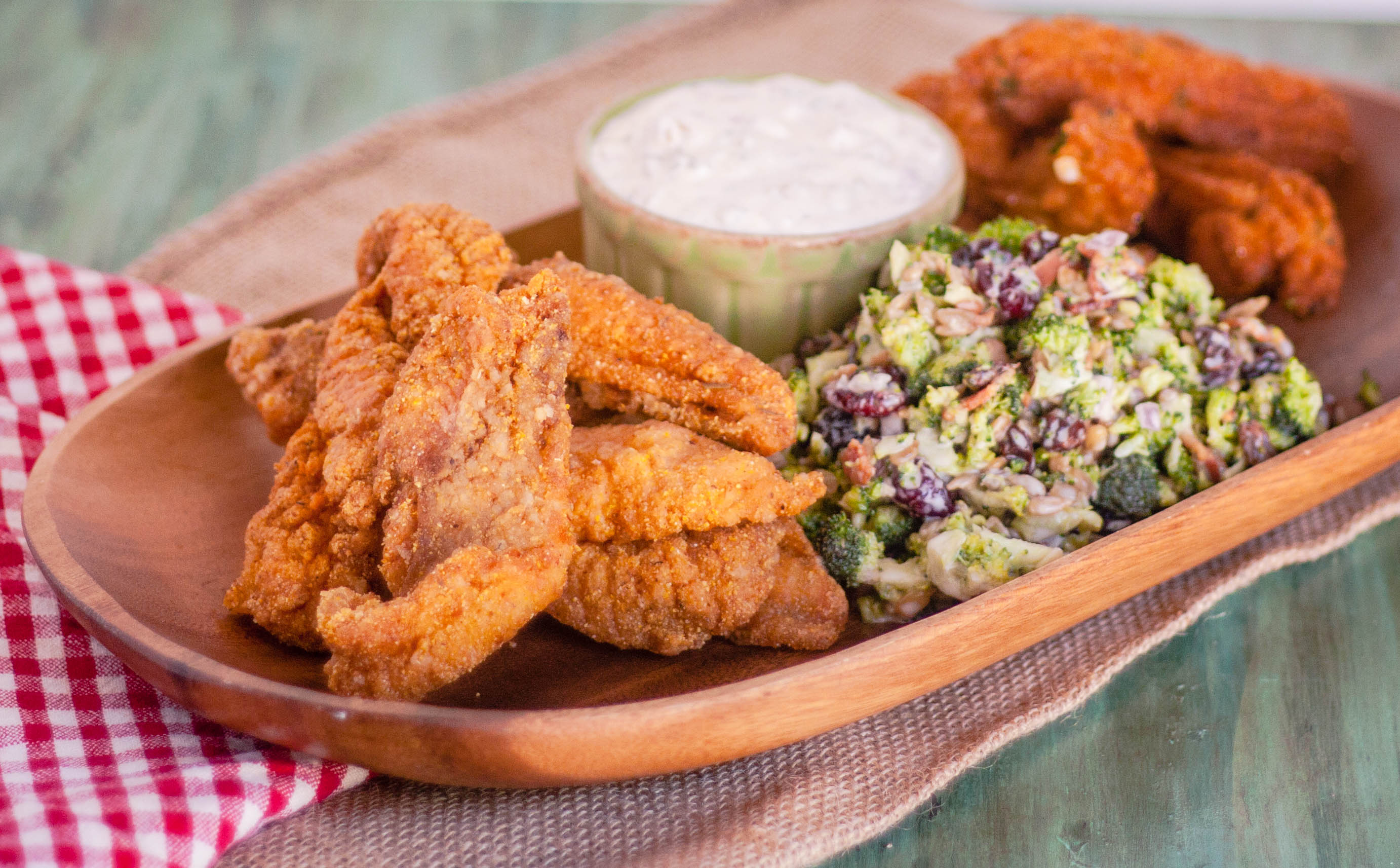 Cajun fried fish with sauce and coleslaw