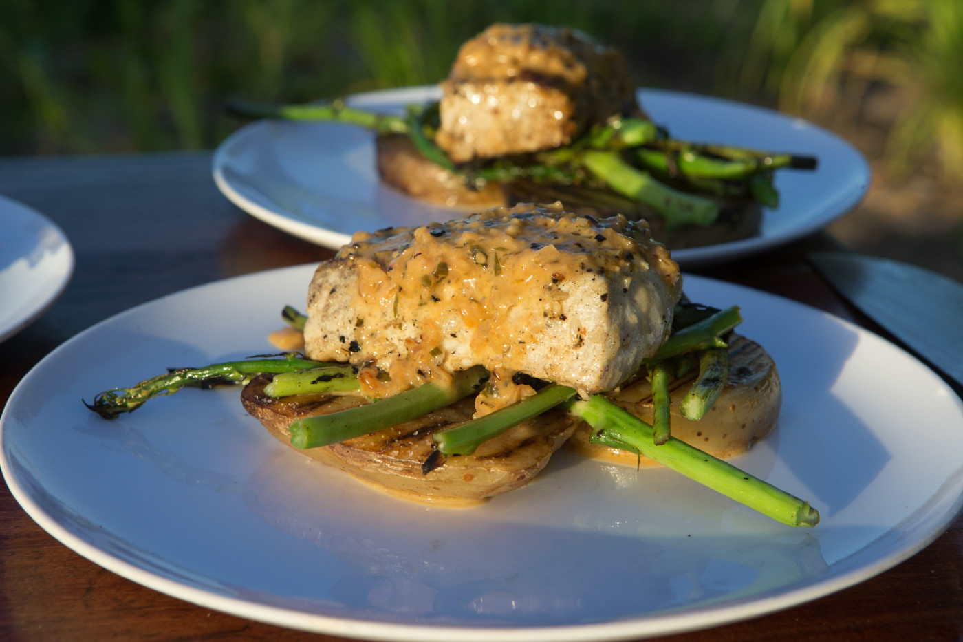 smokey barracuda with seared potatoes and palm of heart, red oinion, and asparagus salad