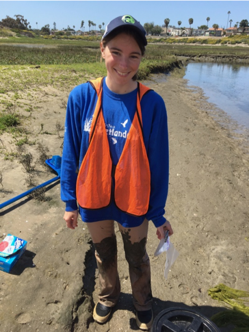 katie happy in the mud