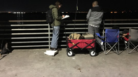 California Sea Grant Extension Research Assistant Nina Venuti surveying a recreational lobster fisherman on Shelter Island pier on a Saturday night in March. Photo taken by Lupita Sandoval.