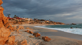 A photo overlooking a beach in Cardiff, California displaying the cliffs, beach, and coastal homes. Image courtesy of project interviewees.