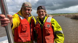 Denise Colombano and her faculty advisor, Dr. Peter Moyle, out on their research vessel sampling fish and invertebrates in Suisun Marsh.