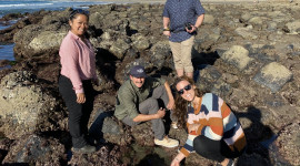 Group of people standing by tide pools