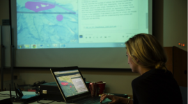 Morgan Visalli, 2015 Sea Grant Fellow at CINMS, displaying SeaSketch on the projector screen during the fourth Marine Shipping Working Group meeting in October 2015.