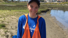 Katie, happy after being knee deep in mud looking for her favorite fish.