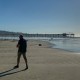 two men walking on beach