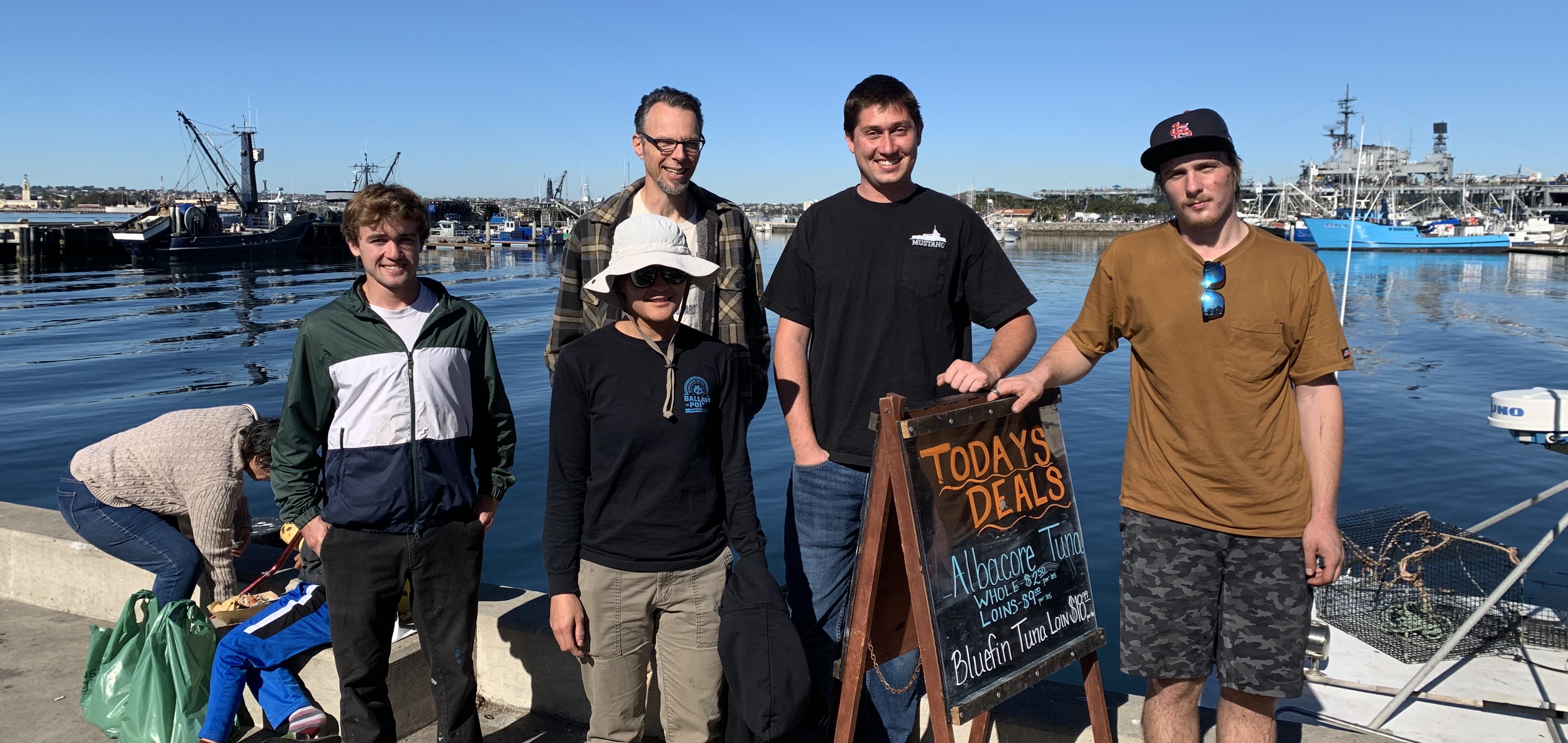 All five fishing apprentices standing on the fishing dock.