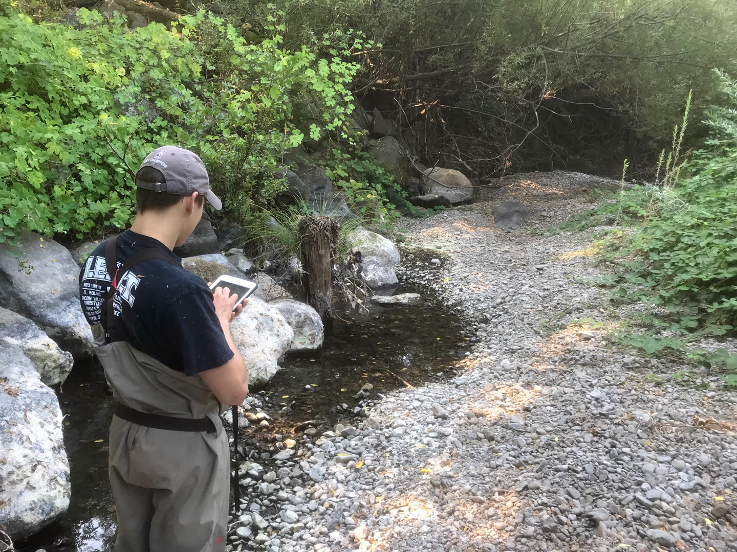 A CA Sea Grant intern conducts wet/dry mapping on Mill Creek. 